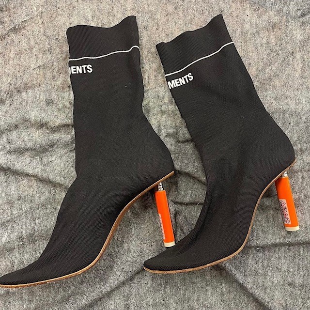 black ankle booties with orange heels