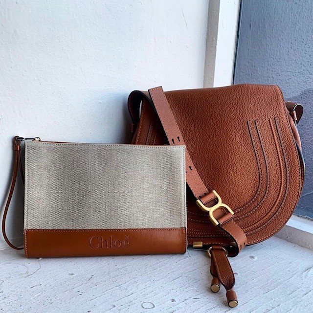 Two resale designer bags, a canvas pouch and brown saddle bag