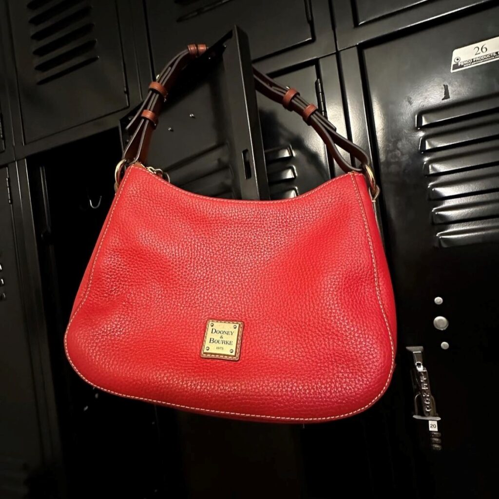 Red leather shoulder bag, an example of popular 90's purses