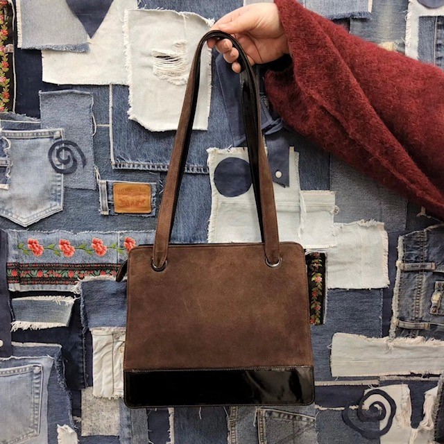 brown suede handbag in a classic shoulder bag style