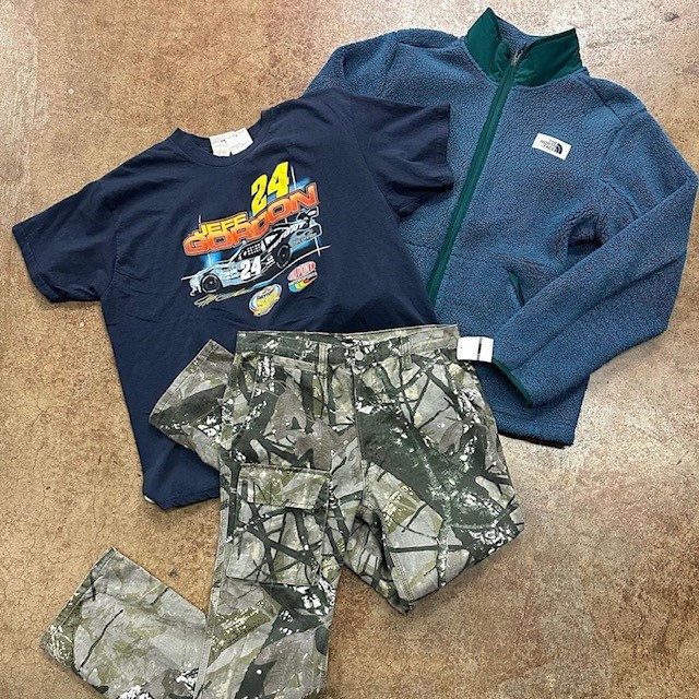 men's clothing resale items: paint splash cargos, race car tee, and fleece jacket