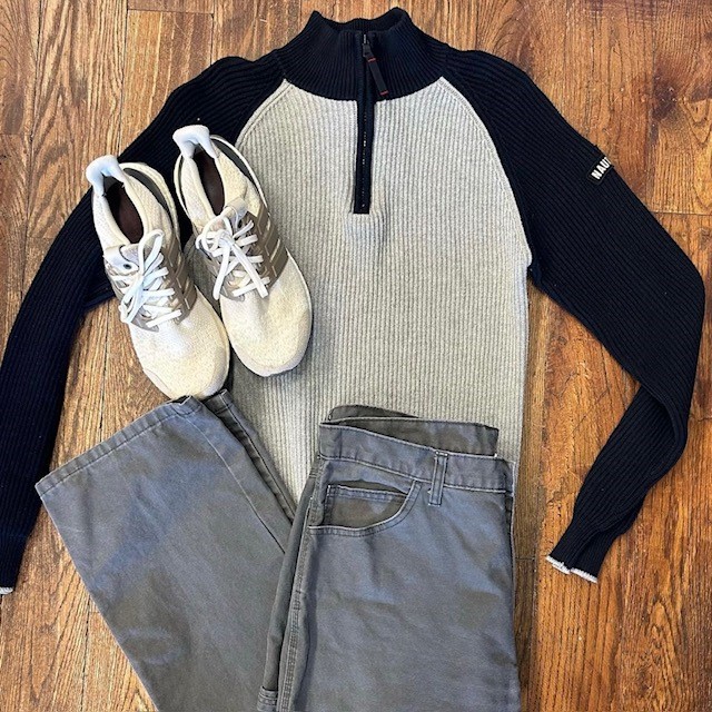 black and gray ribbed seater, mesh sneakers, and gray denim pants