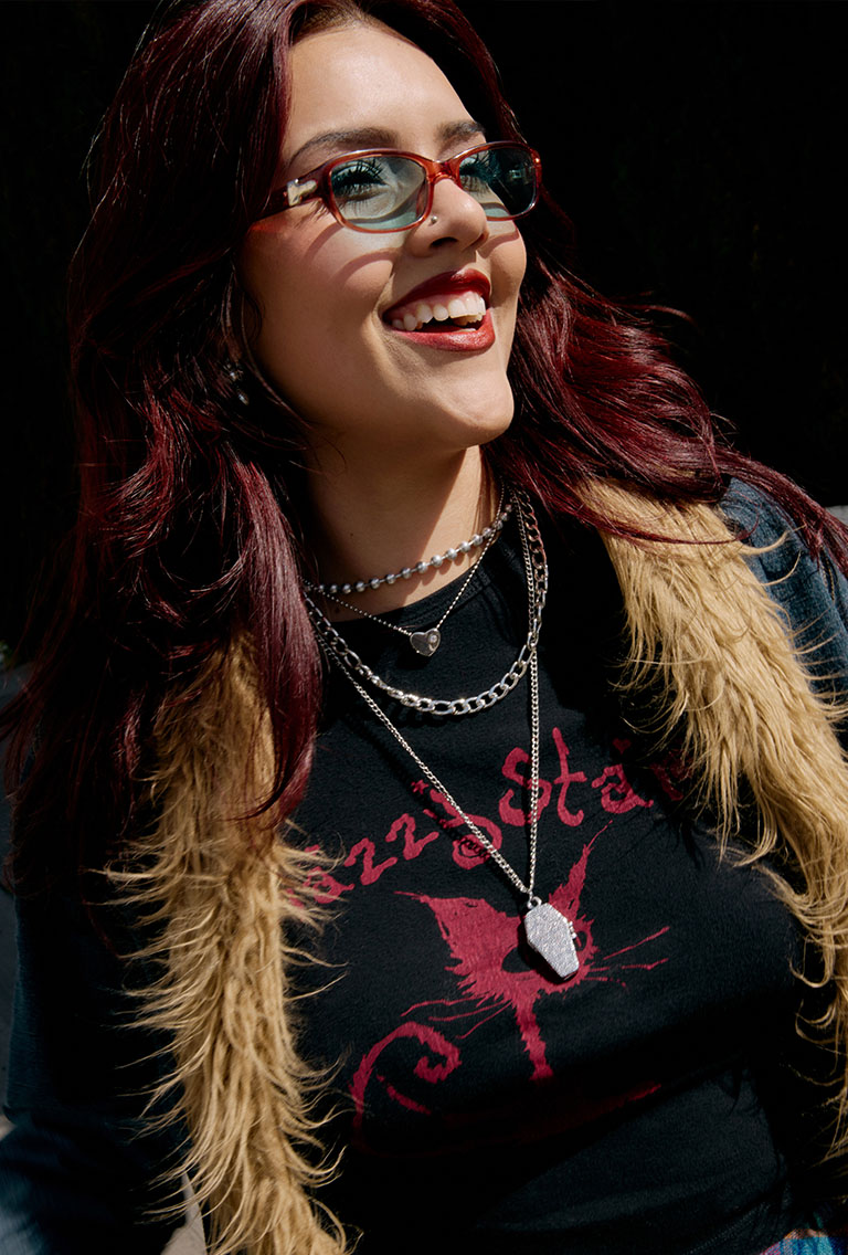female model with Red hair wearing a denim penny lane jacket and a black tee shirt with a cat on the shirt