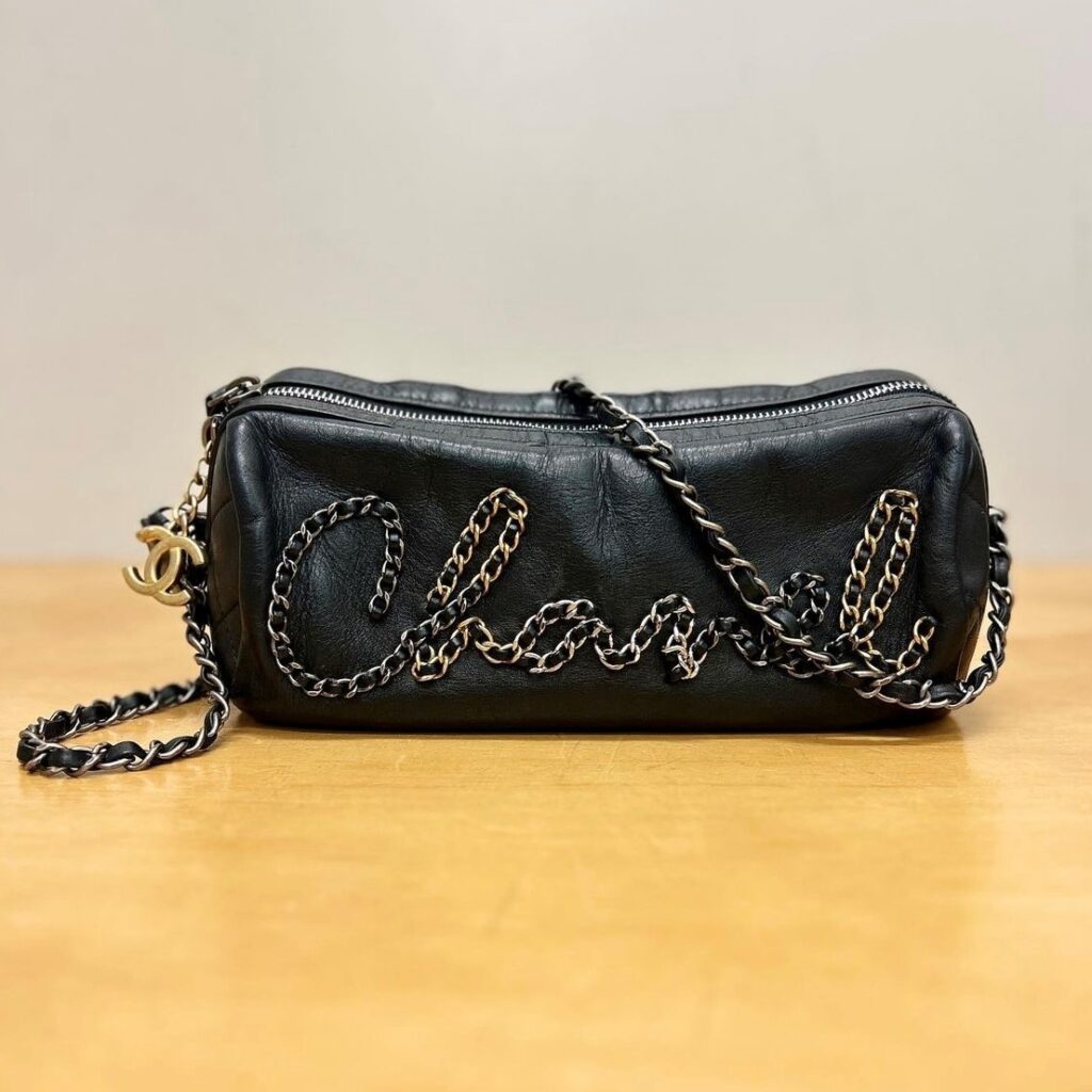 vintage designer Chanel bag in a pencil pouch style with chain strap