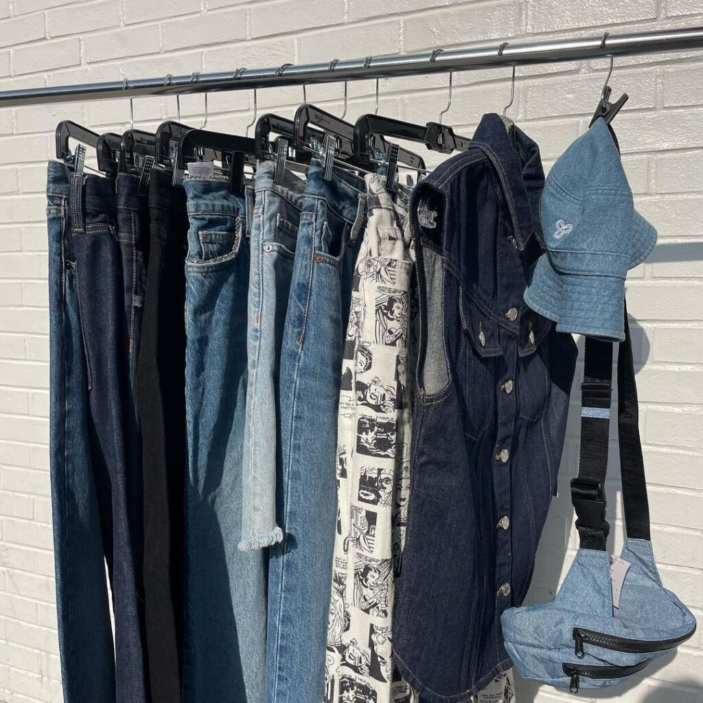 rack of denim clothing