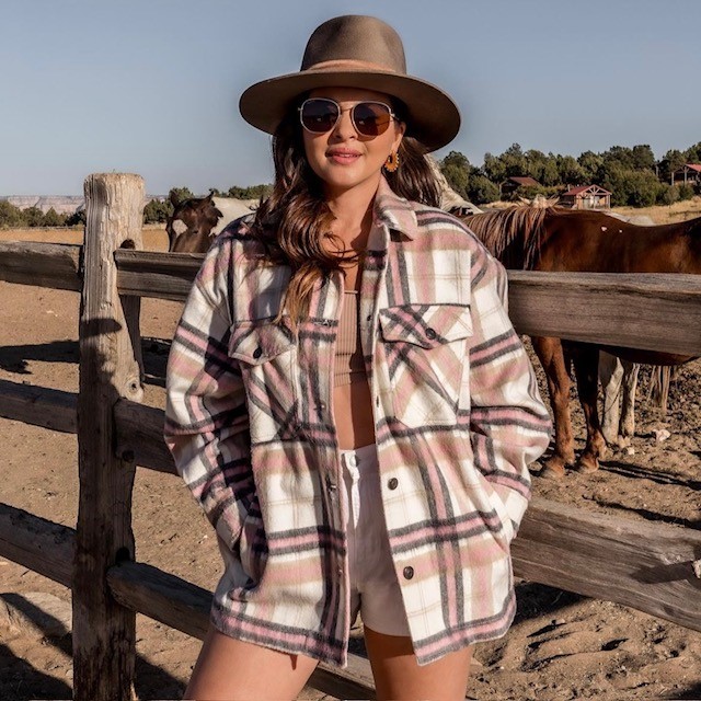 woman wearing on in cream, brown, and dusty rose colors