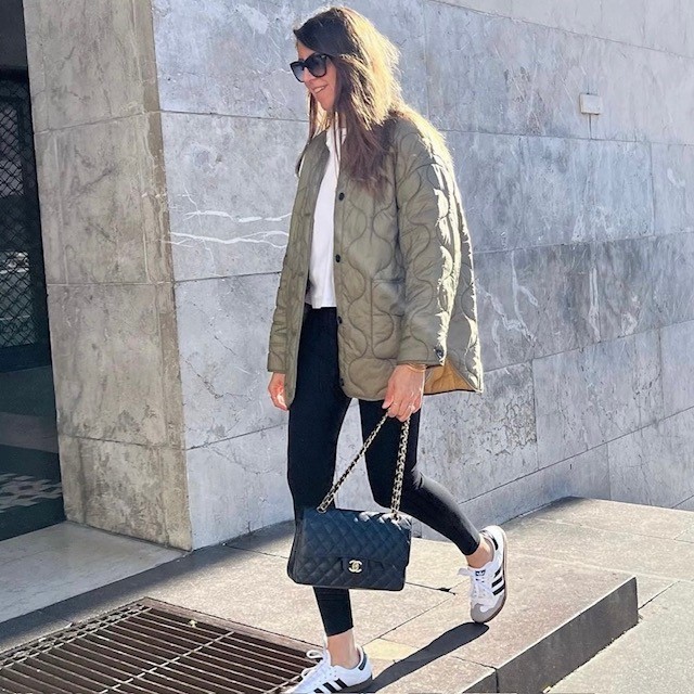 woman in khaki-colored quilted jacket