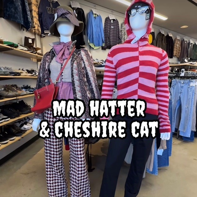 Two mannequins dressed in thrift store Halloween costumes as the Mad Hatter and the Cheshire Cat