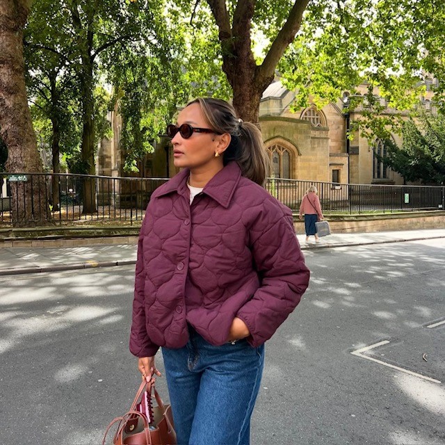 woman in burgundy-colored quilted jacket