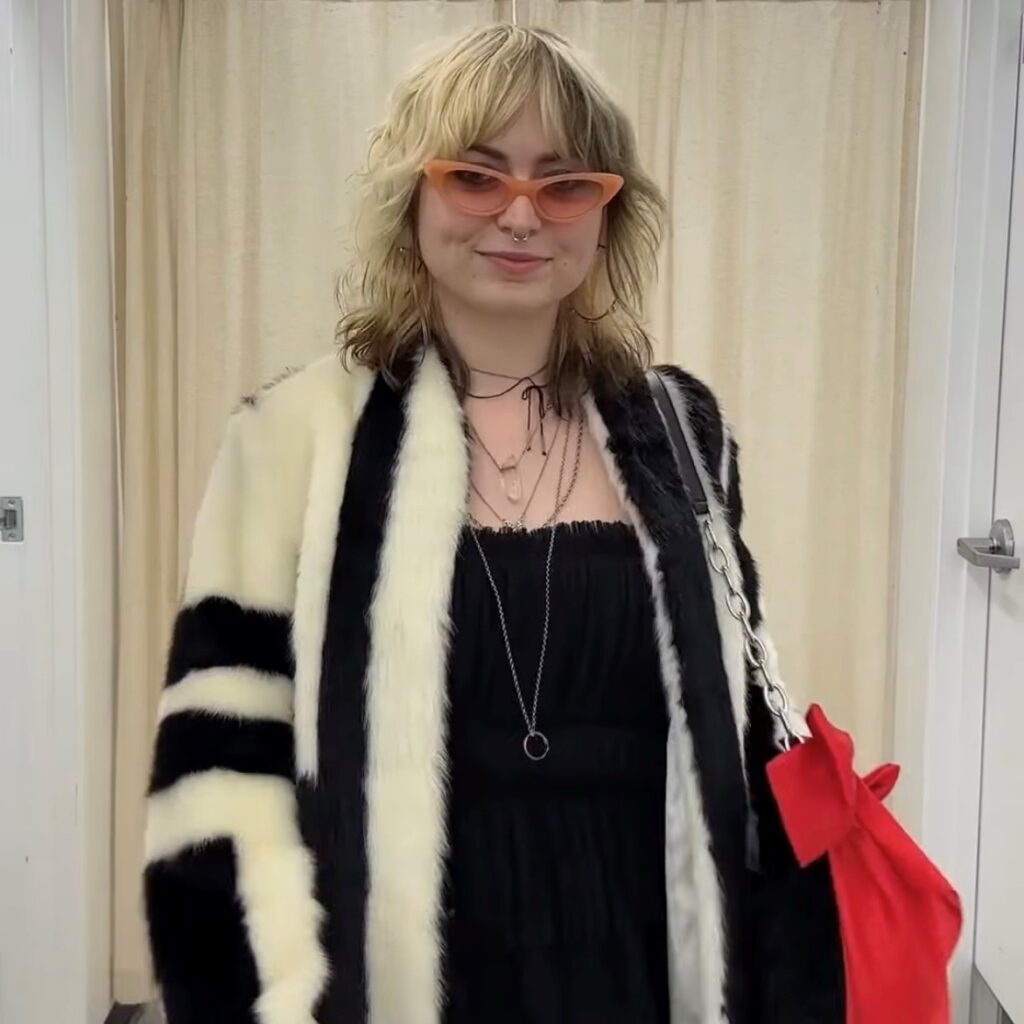 woman dressed in Halloween costume as Cruella de Vil