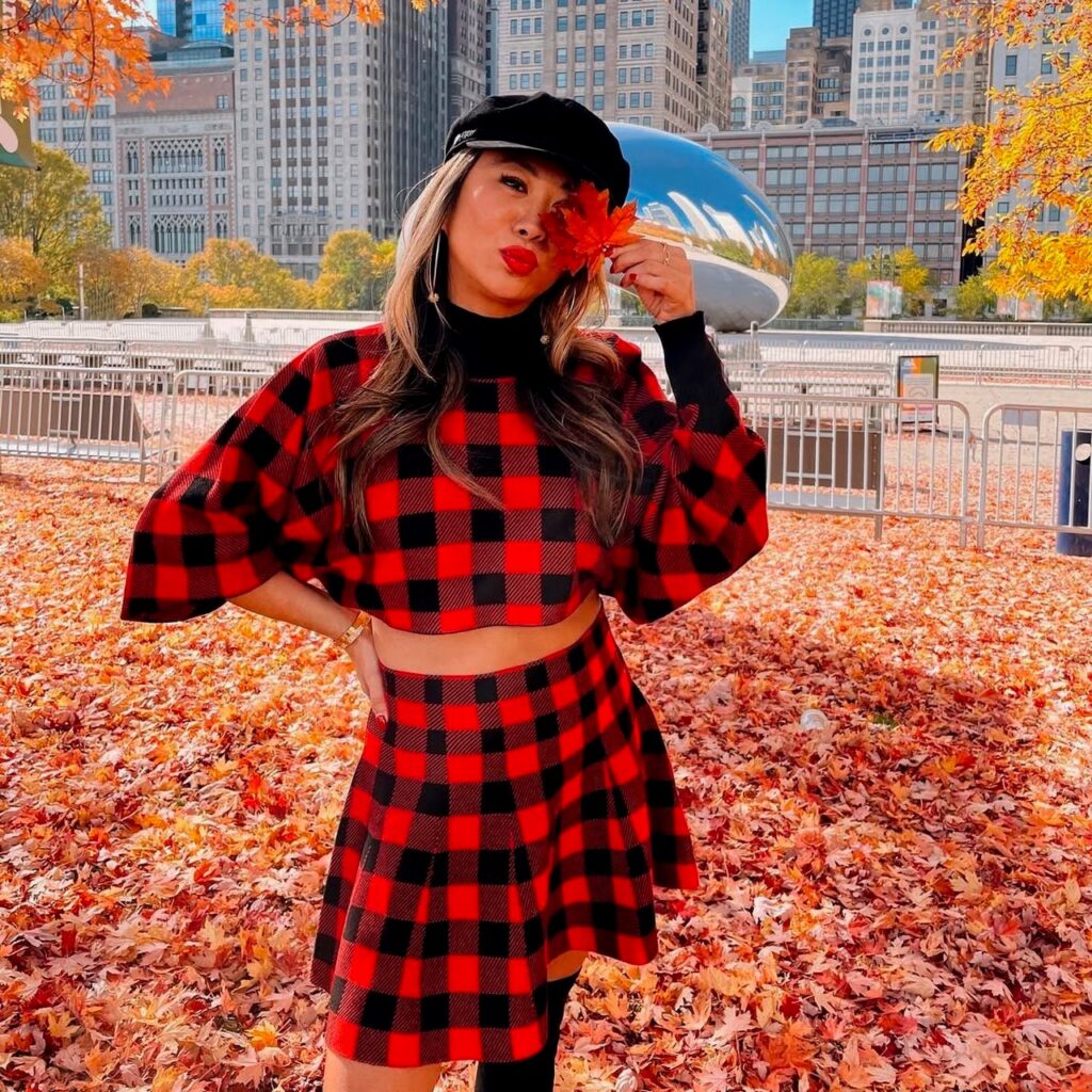 woman wearing a matching set in red and black plaids