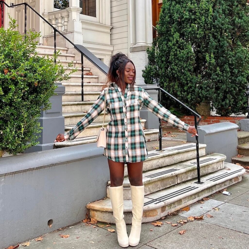 woman in cream-colored pair with plaid flannel dress 