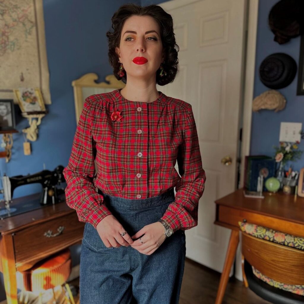 woman wearing a red tartan shirt with vintage jeans