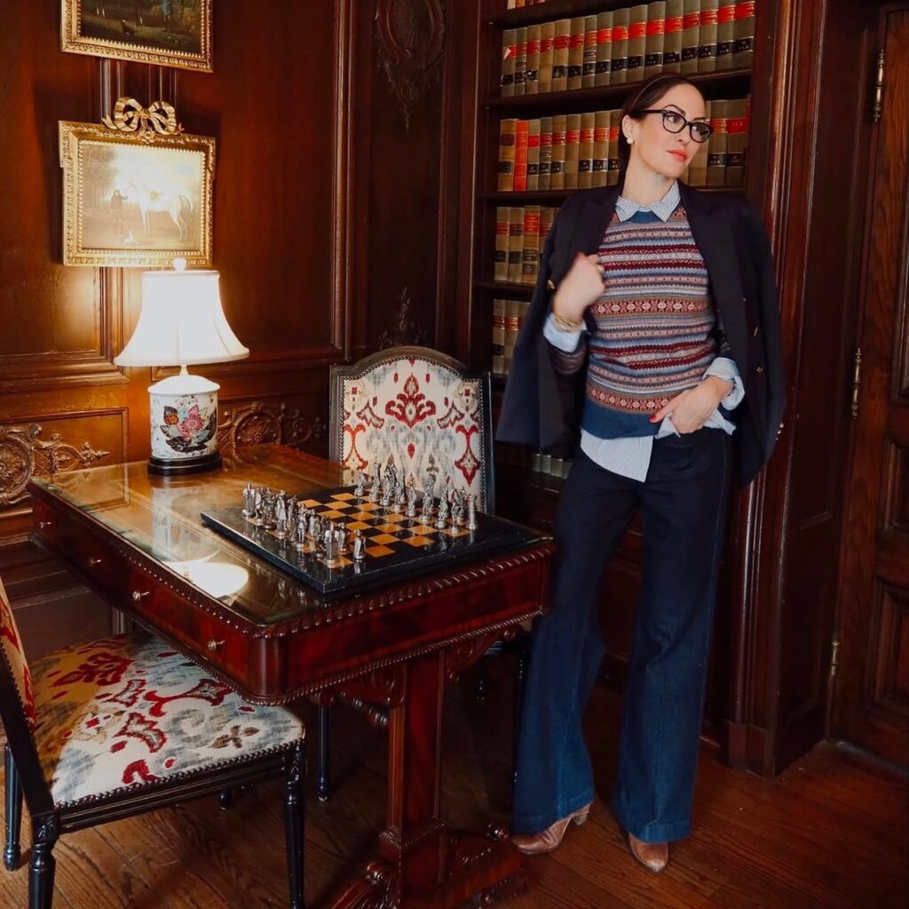 woman wearing a Fair Isle version with a blazer and flared denim