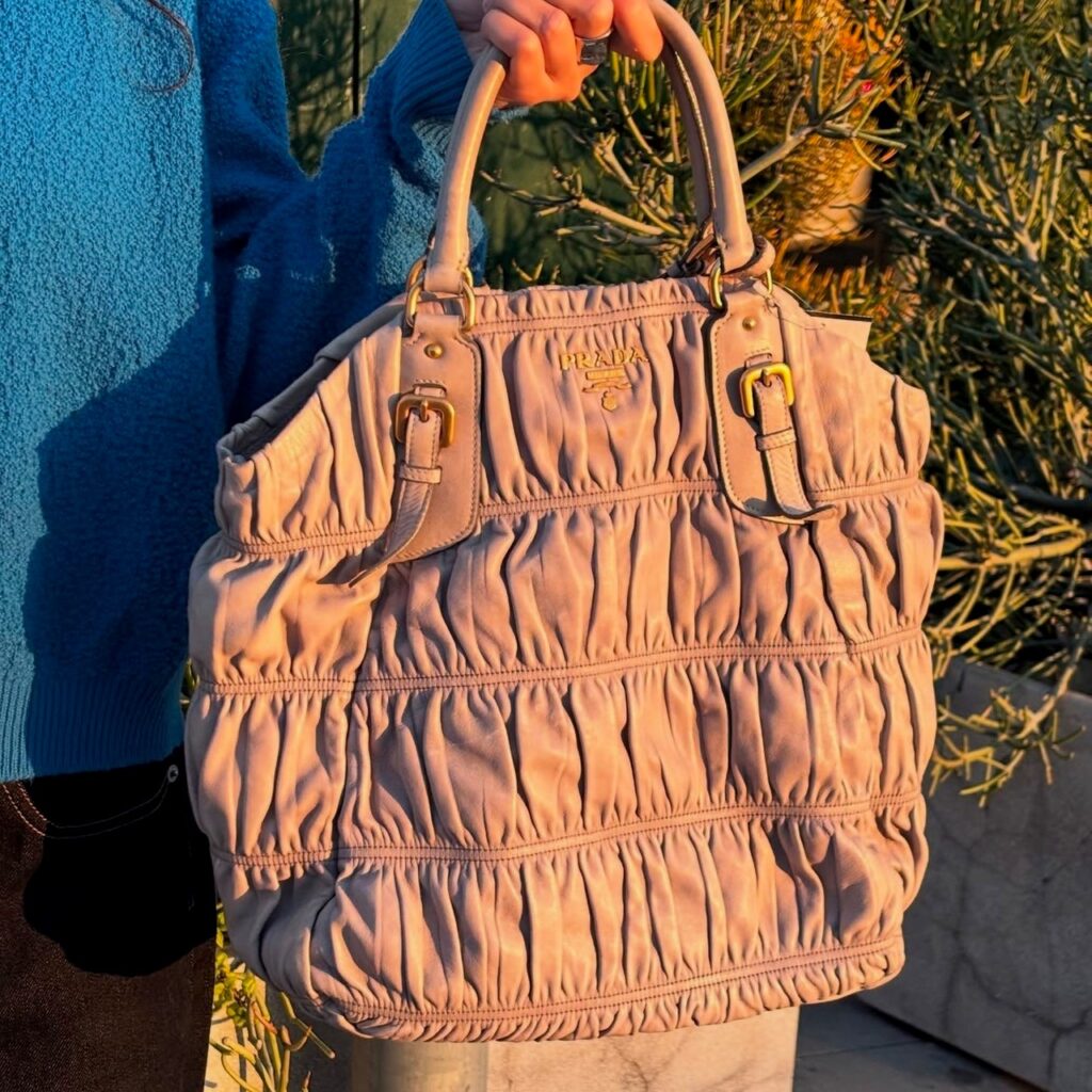 an example of large handbags: a ruffled leather Prada bag