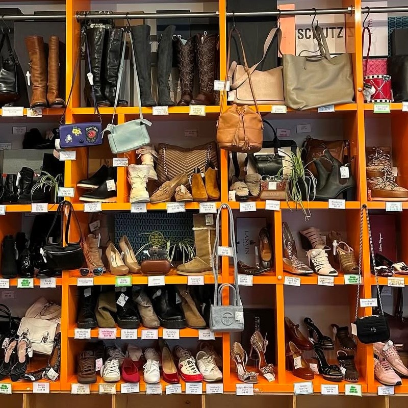 shelves of shoes and handbags in a secondhand store