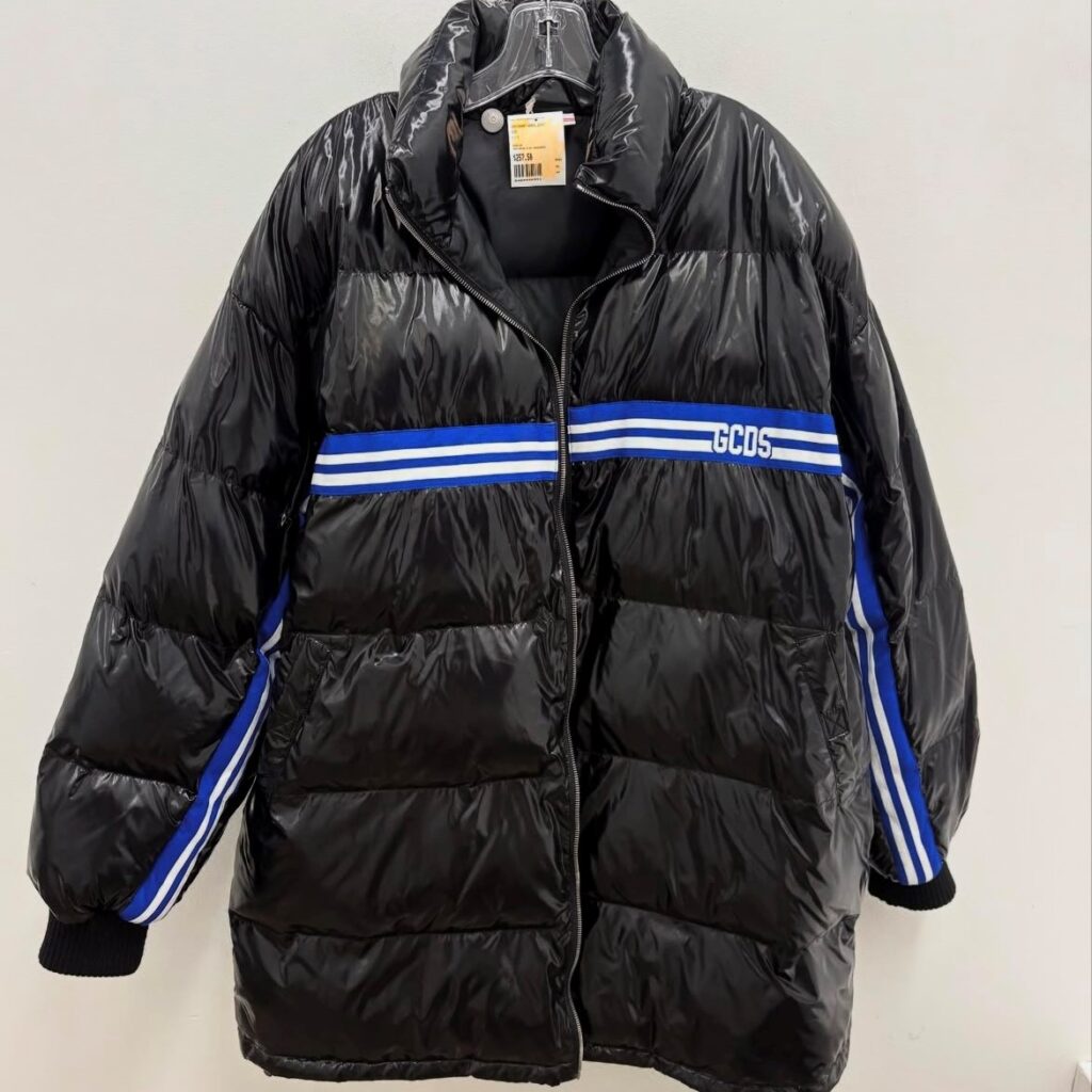 black puffer coat with blue and white detail