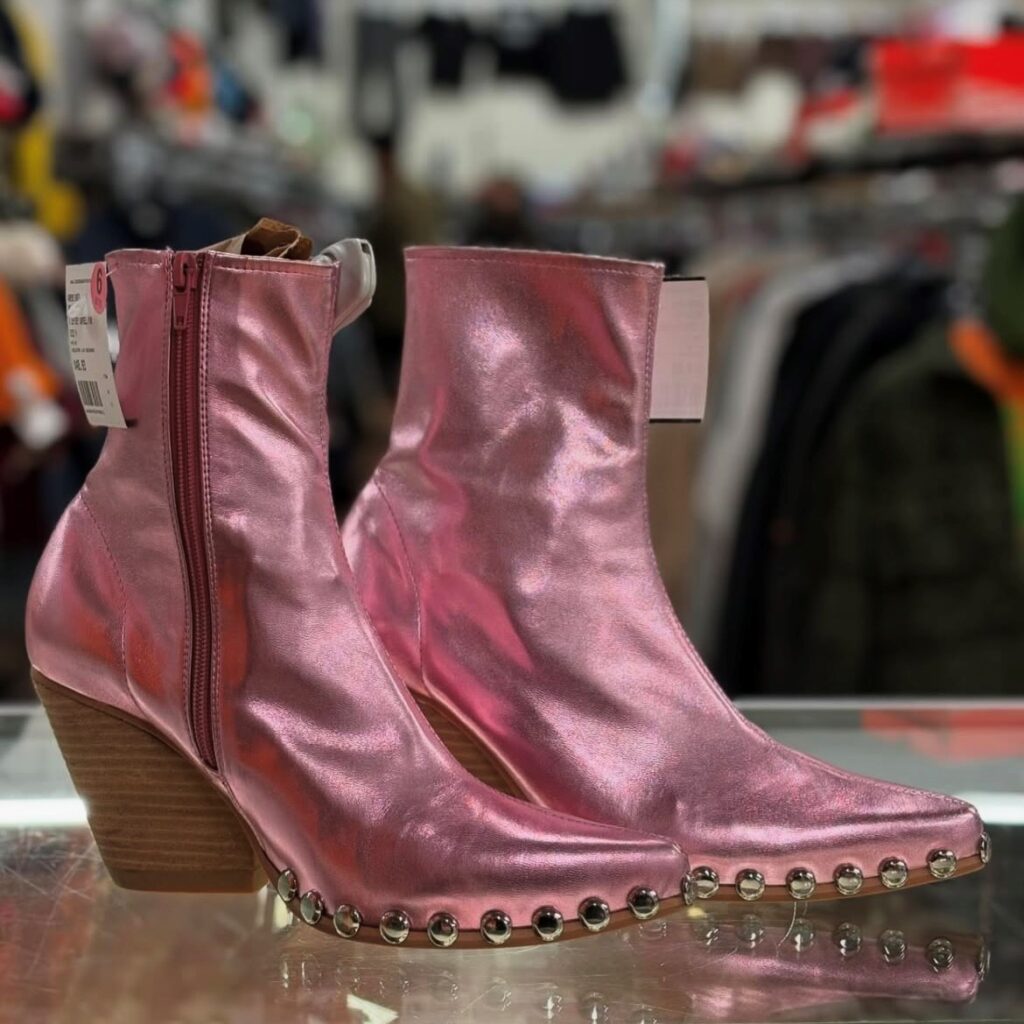 metallic pink booties in a secondhand store