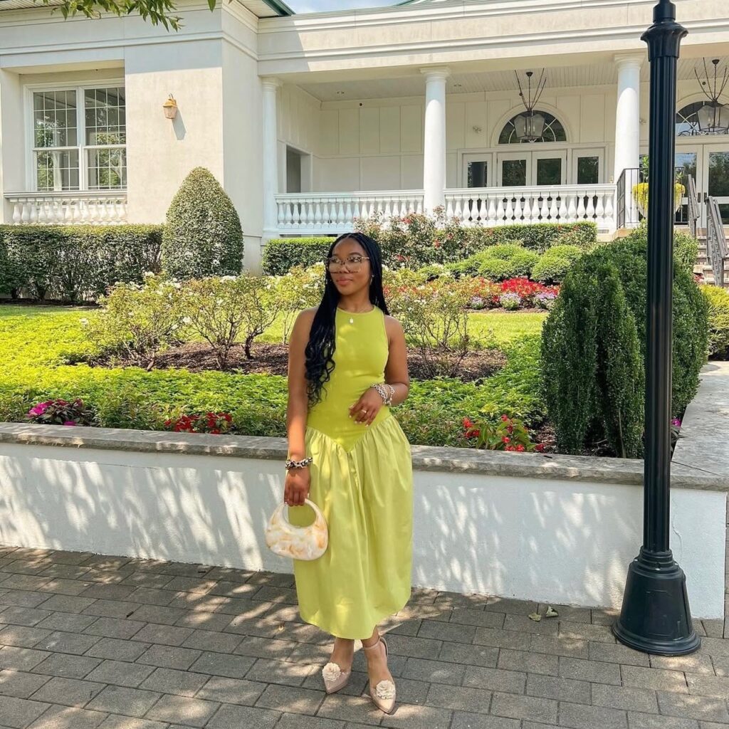woman in a yellow drop waist dress