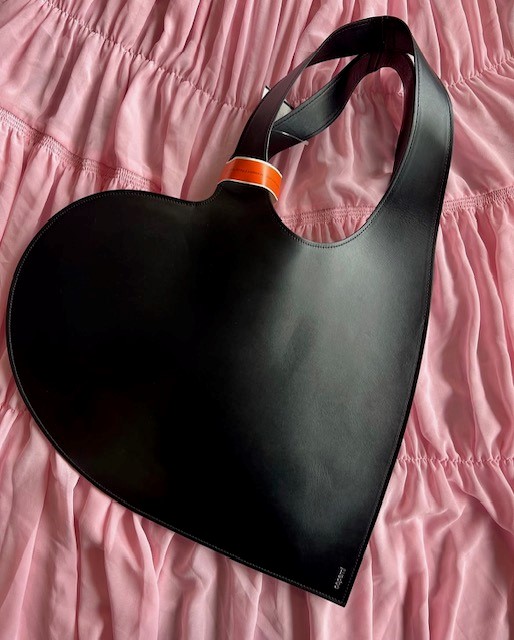 a thrifted black leather shoulder bag