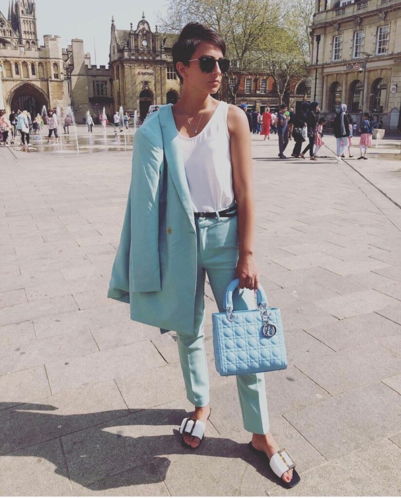 person in baby blue suit