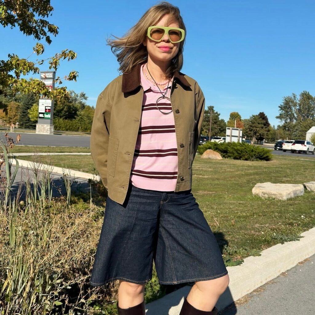 woman with striped sweater with jean shorts and cropped jacket