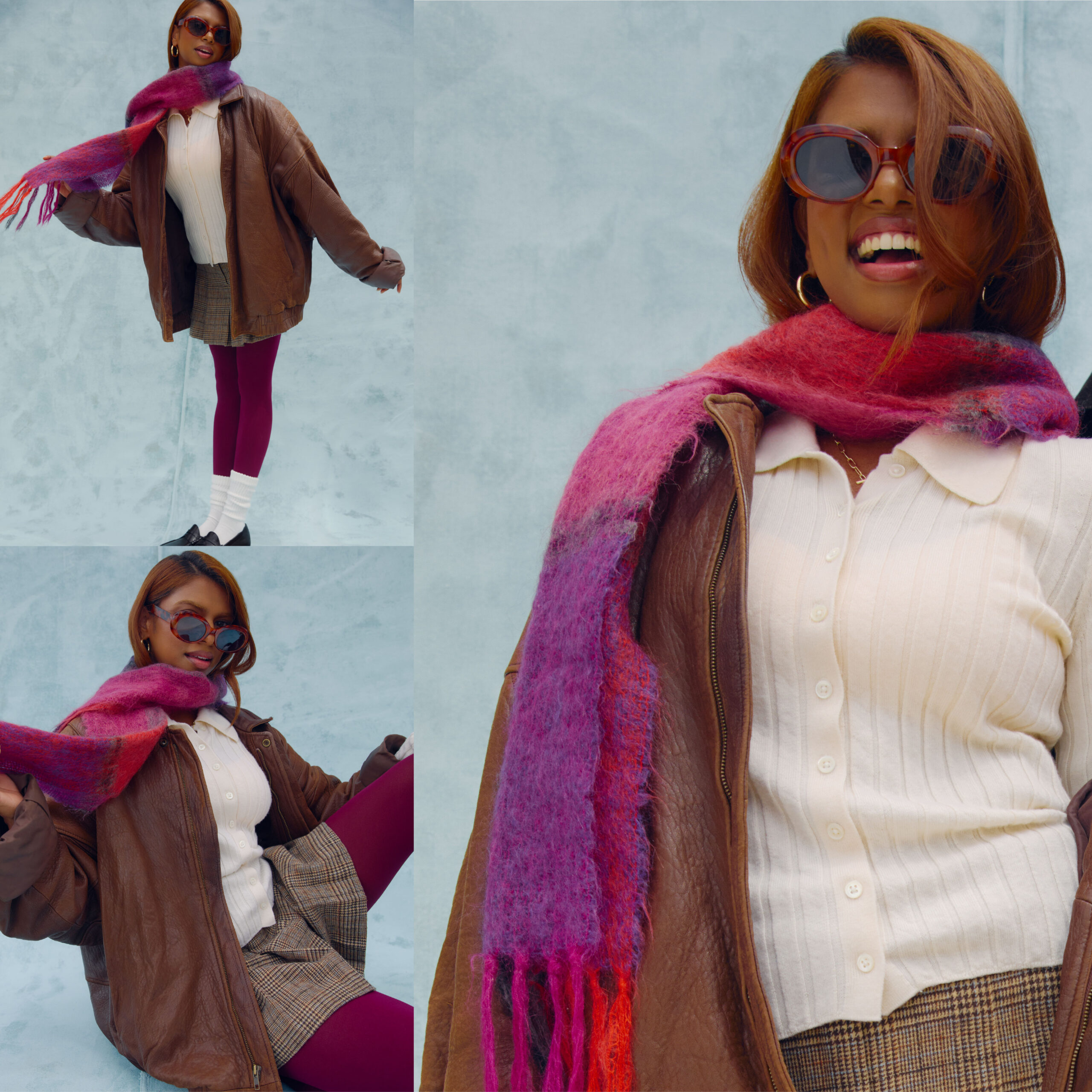 Female model is wearing a brown leather oversized jacket, a white button up collard cardigan, a brown plaid mini skirt, burgundy tights, white socks and brown loafters. Accessories are red sunglasses, and a pink and purple knit scarf