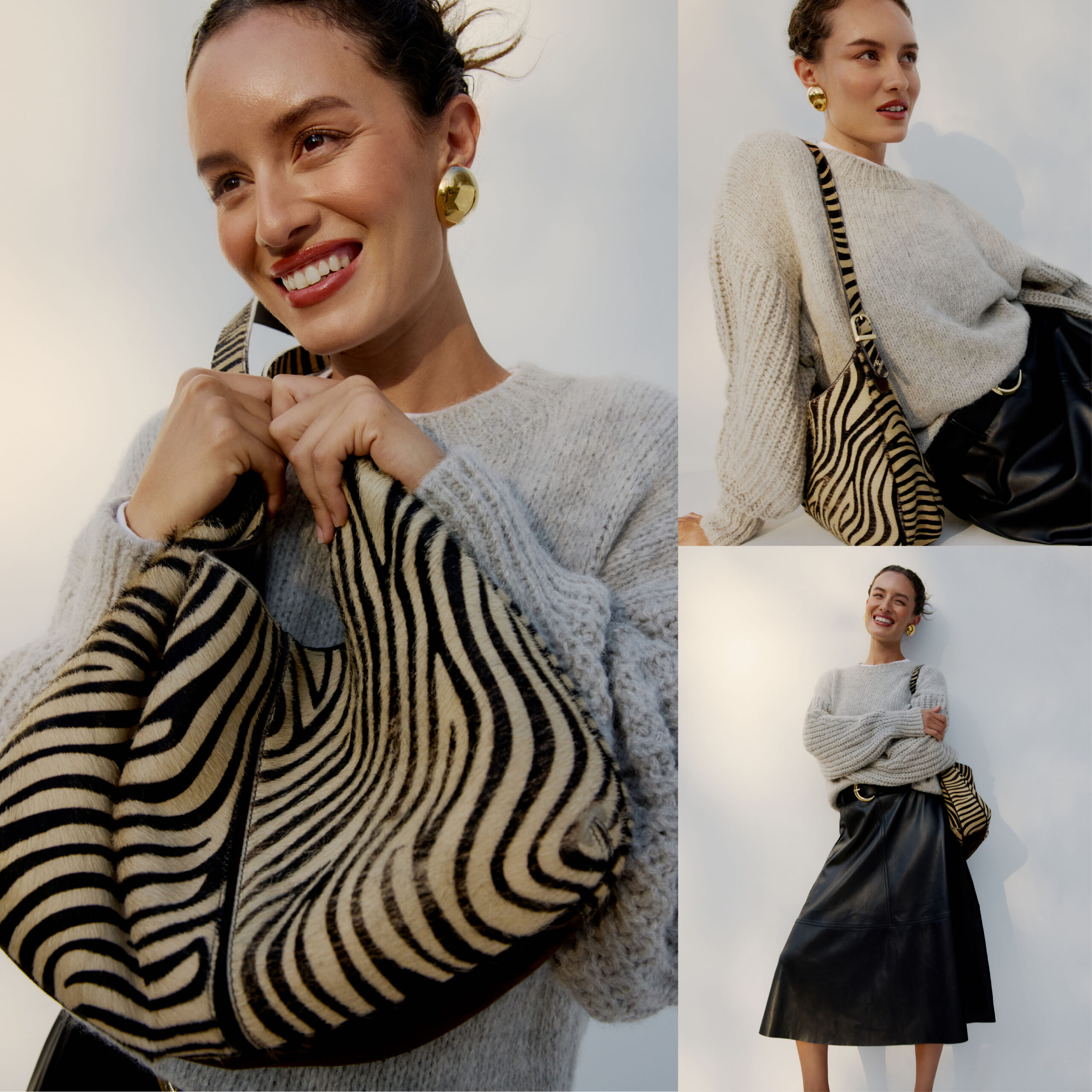 Female model wearing a grey sweater, black faux leather skirt with matching help, holding a zebra print purse