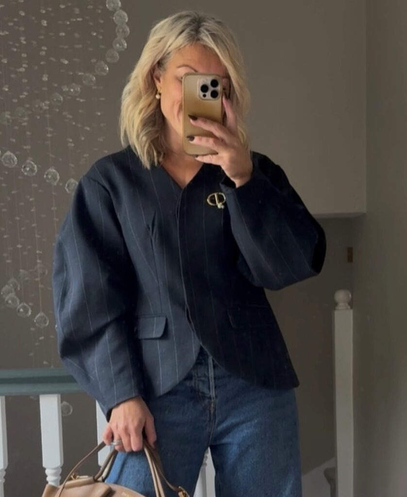 woman in balloon-sleeved jacket