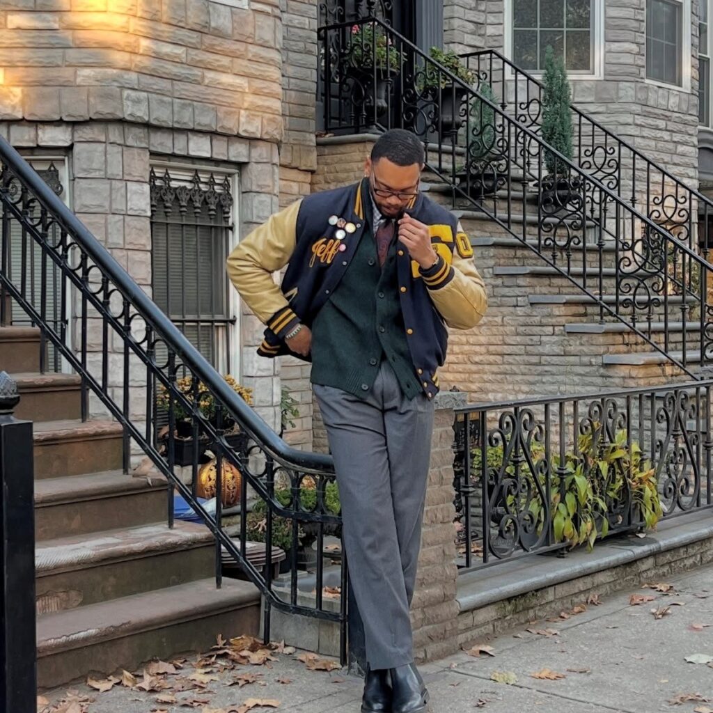 man in varsity jacket