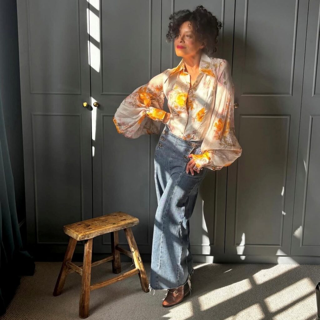 woman in balloon-sleeved top with cropped denim