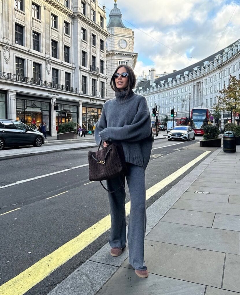 woman in gray oversized turtleneck and gray knit pants