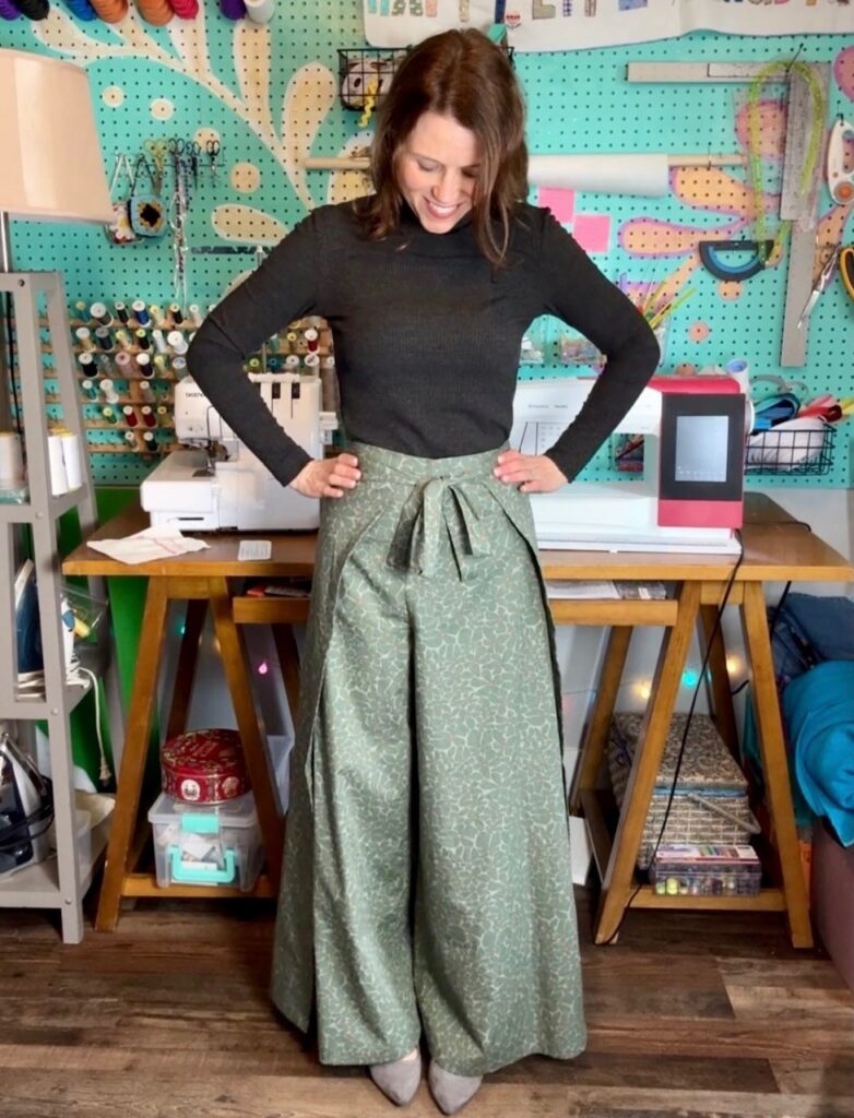 woman in black turtleneck and wrap pants