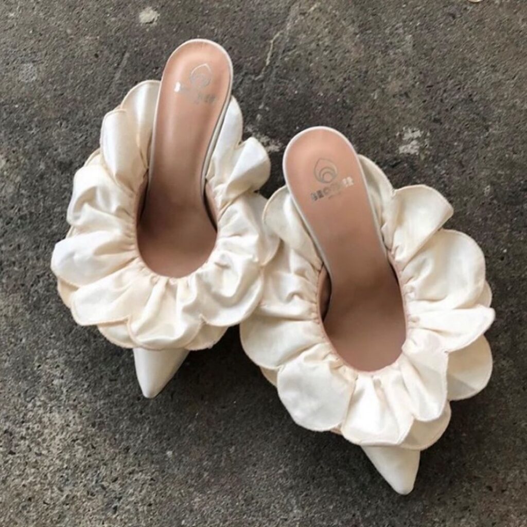 pair of cream-colored heels