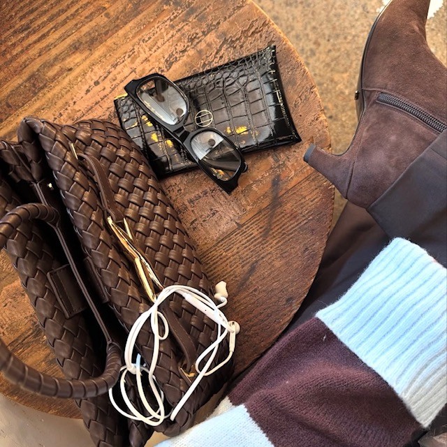 woven bag with wallet and sunglasses