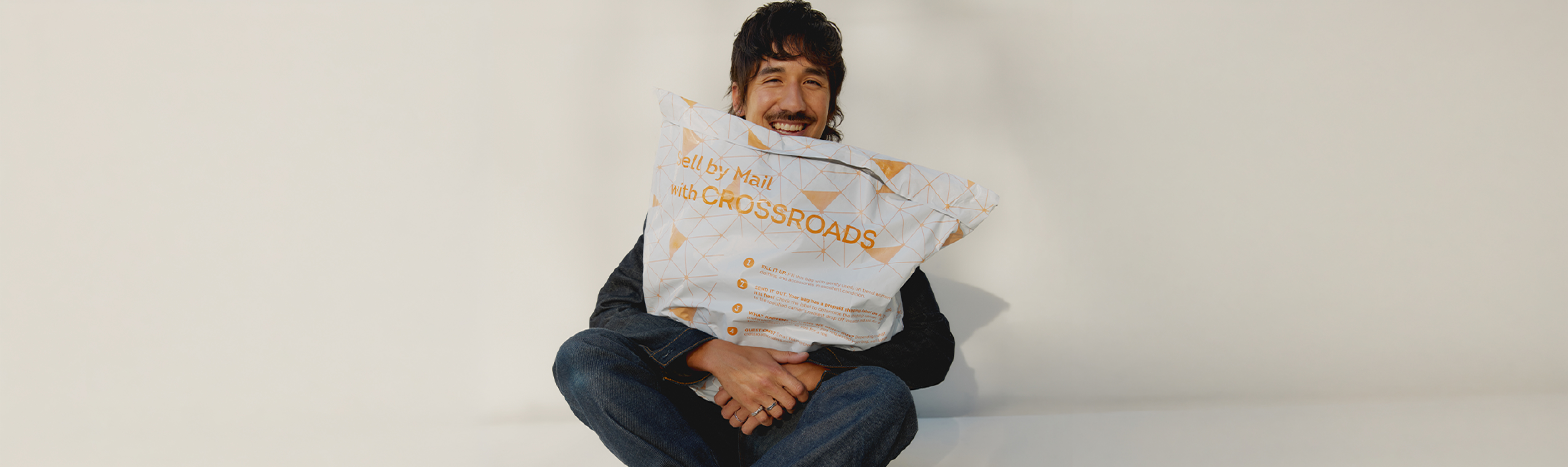 photo of model with sell by mail bag