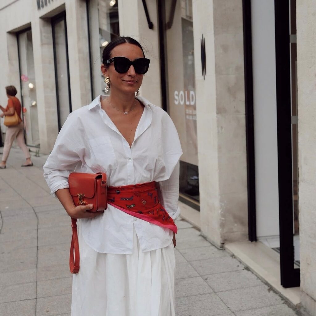 woman wearing a red scarf as a belt