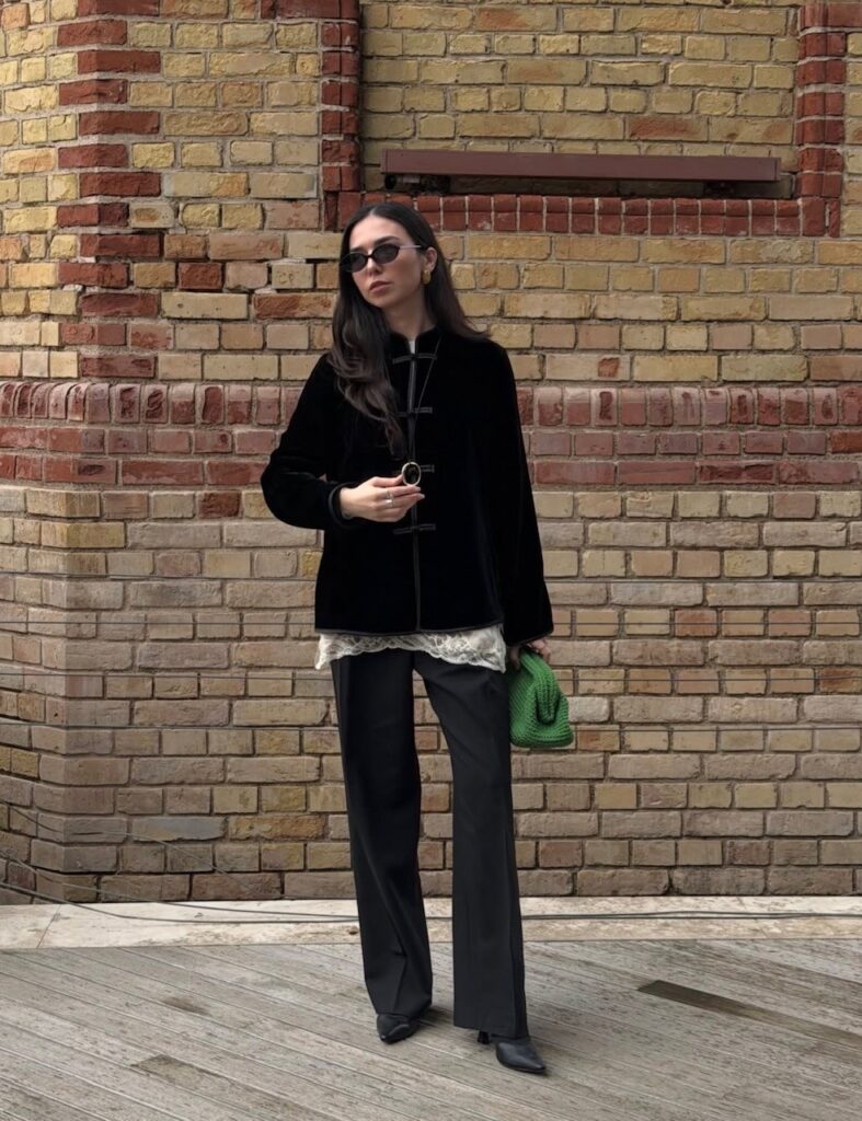 woman in jacket with Mandarin collar and frog closures