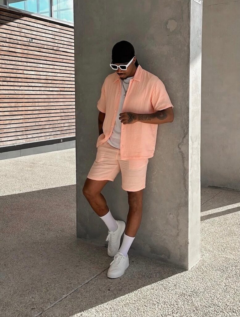 Man in peach colored matching shorts set