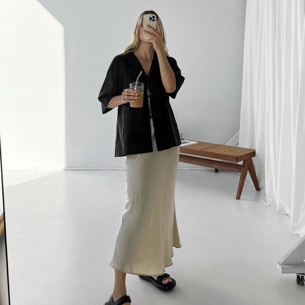 woman in black linen top and slip skirt