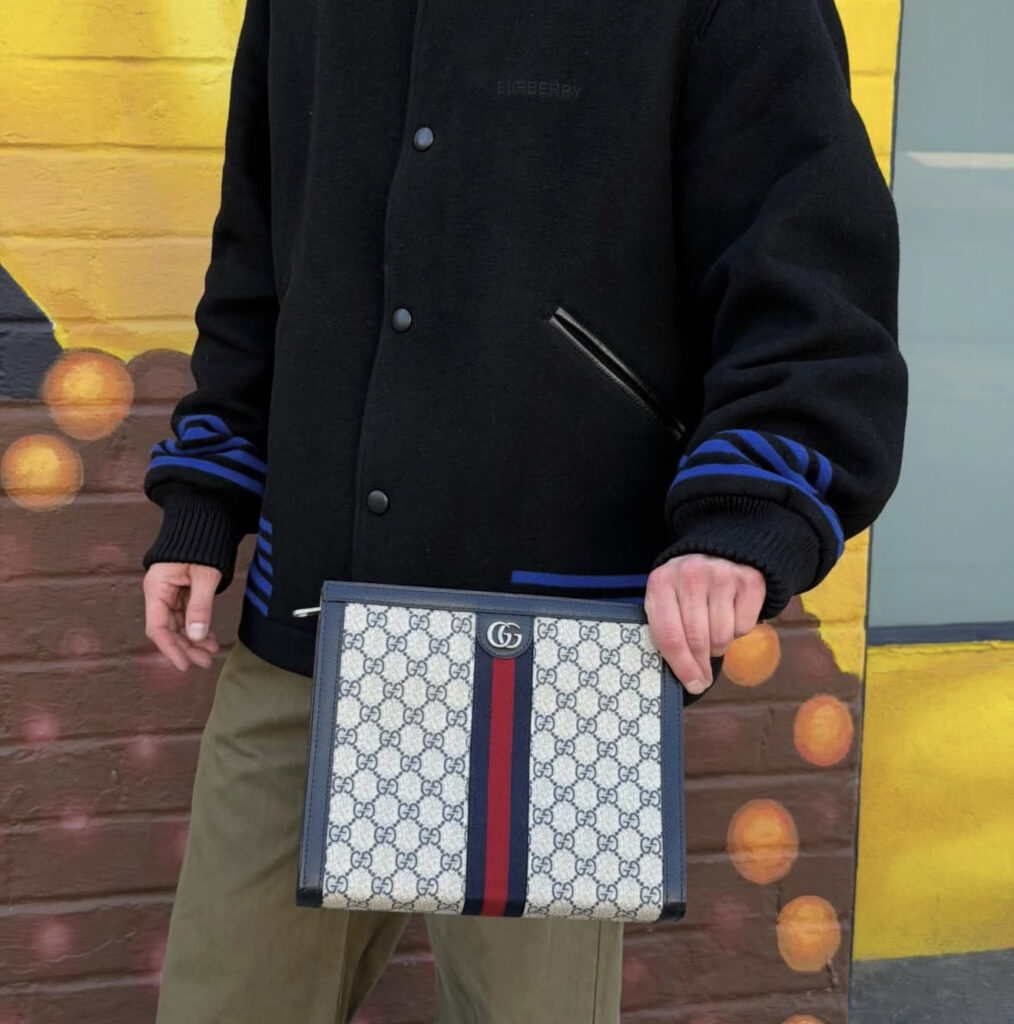 photo of male model with gucci bag