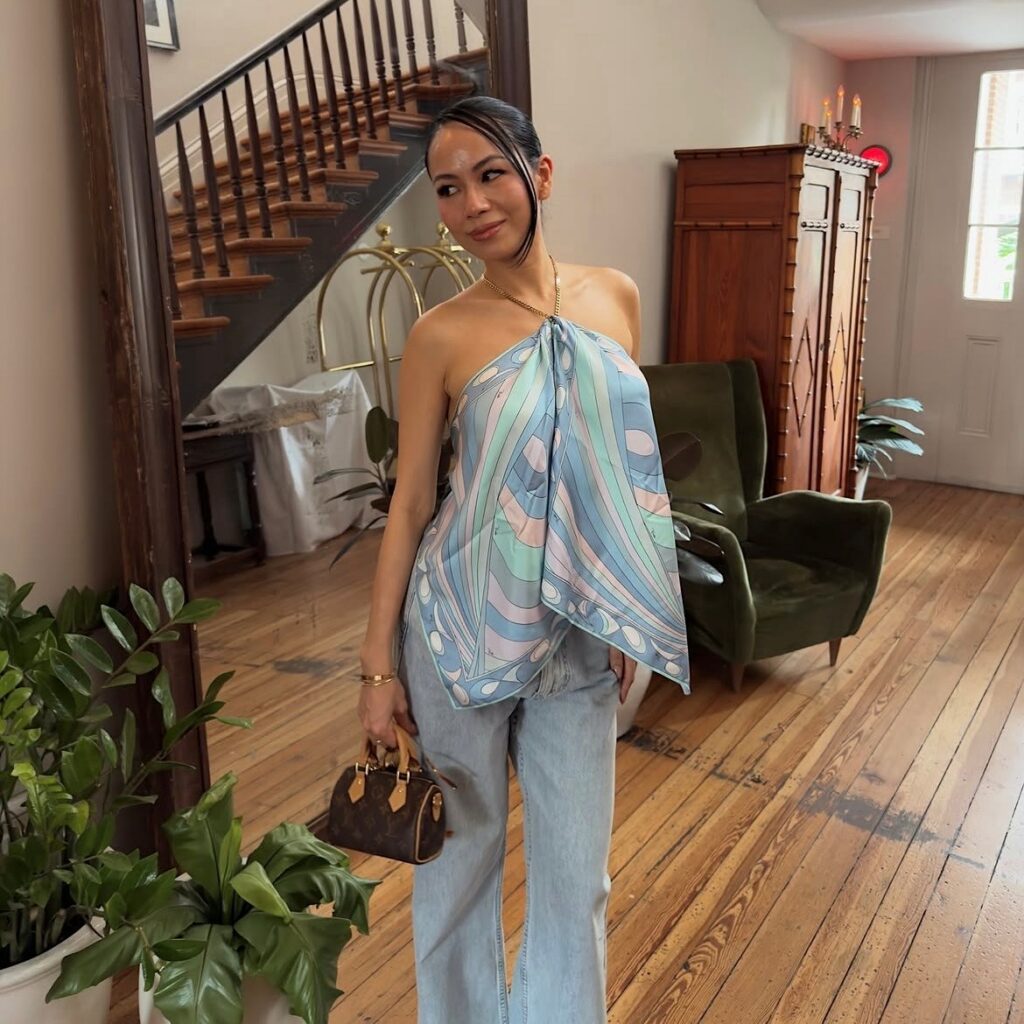 woman in paisley print scarf top and jeans