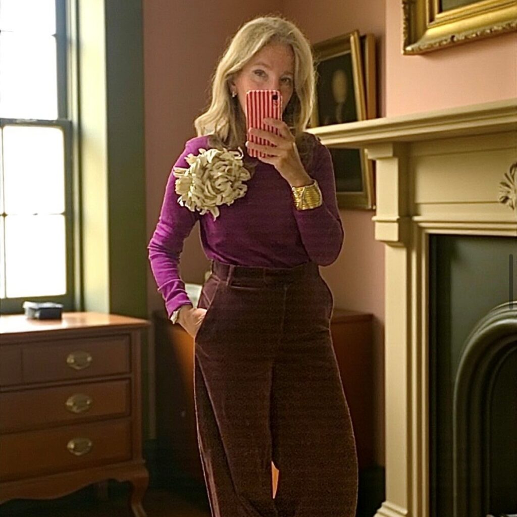 Woman with flower pin on sweater
