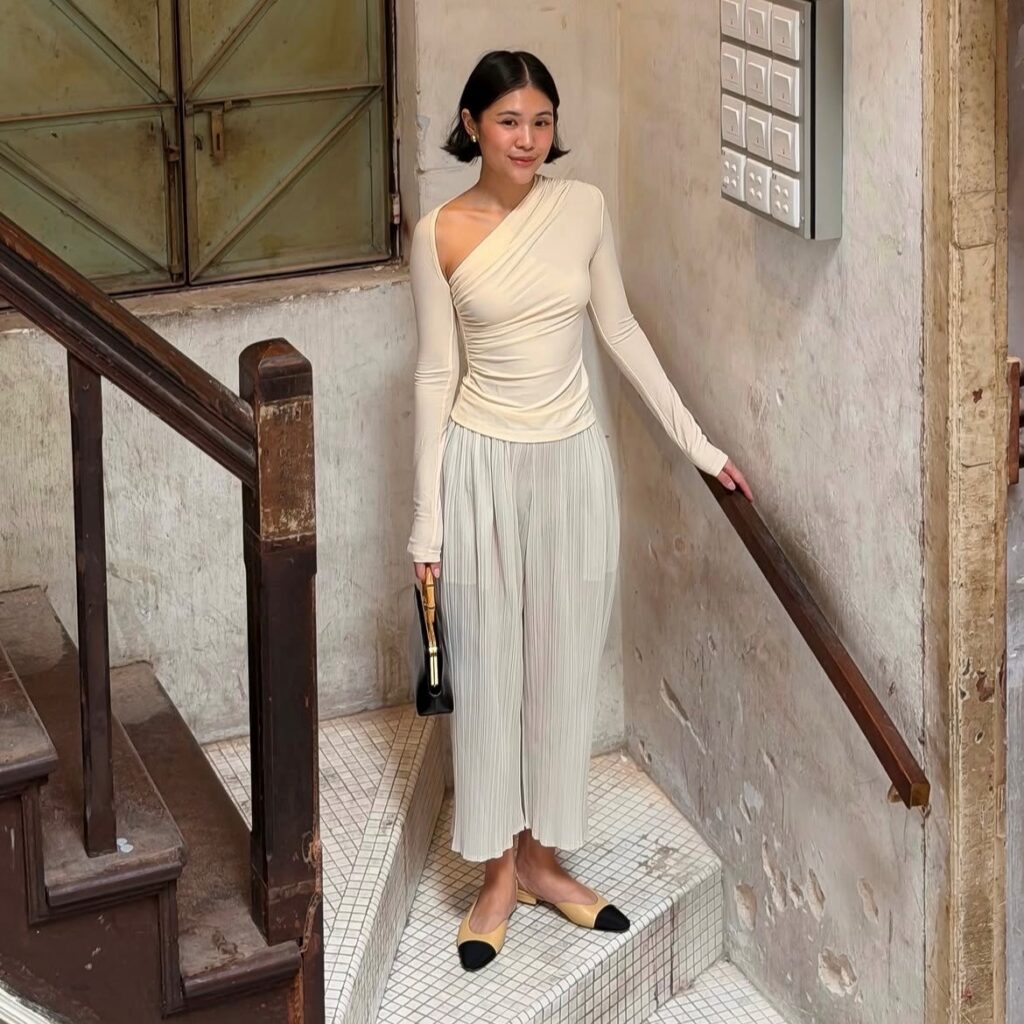 woman in asymmetrical top
